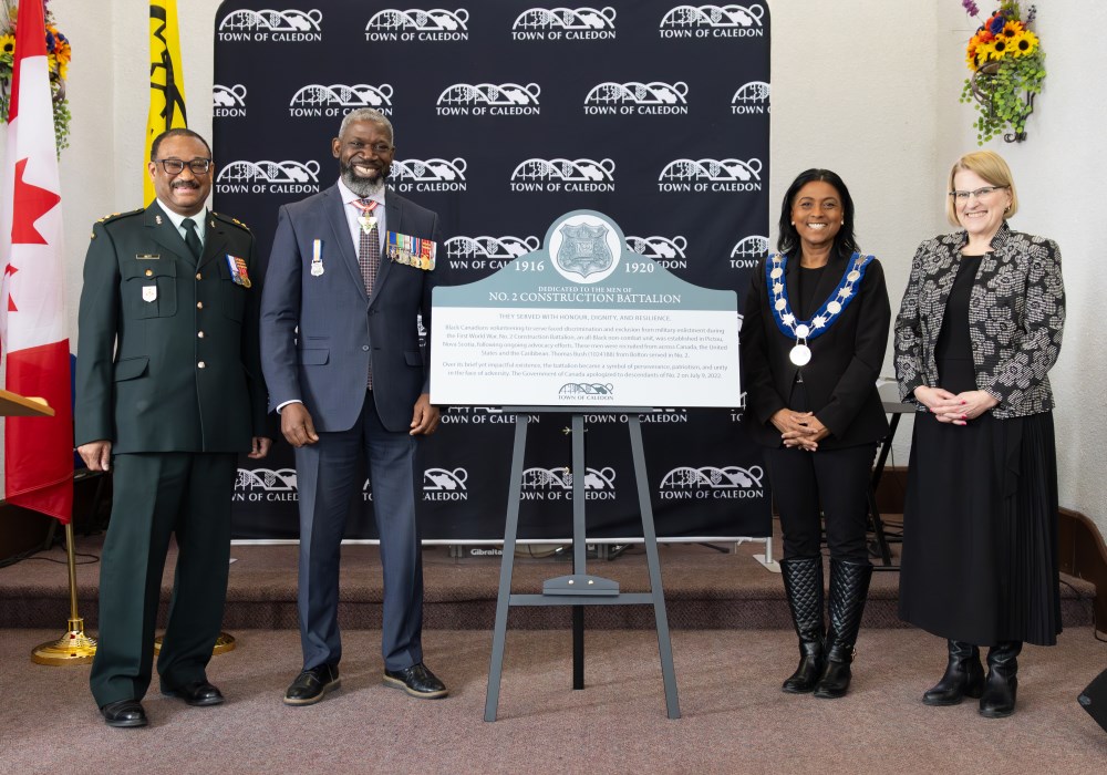 Photo of dignitaries with plaque unveiling
