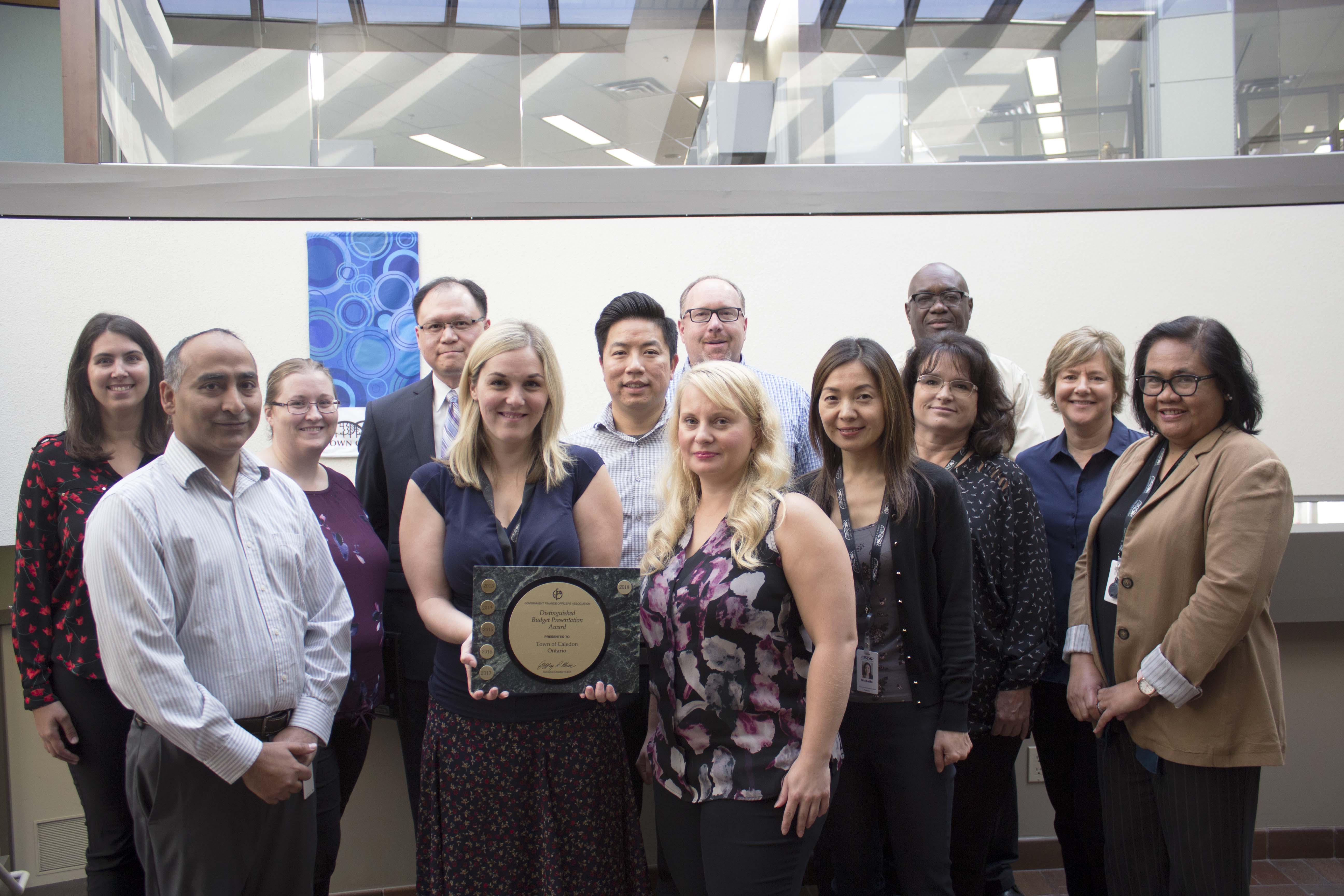 Front row - left to right: Paul Gandhi, Heather Haire, Aleksandra Sebestyen, Michelle Xu, Louise Warn, Vida Reeves, Venus Garnett. Back row – left to right: September Muller, Hillary Bryers, Fuwing Wong, Steven Lee, Mike Galloway, Glendon Turner