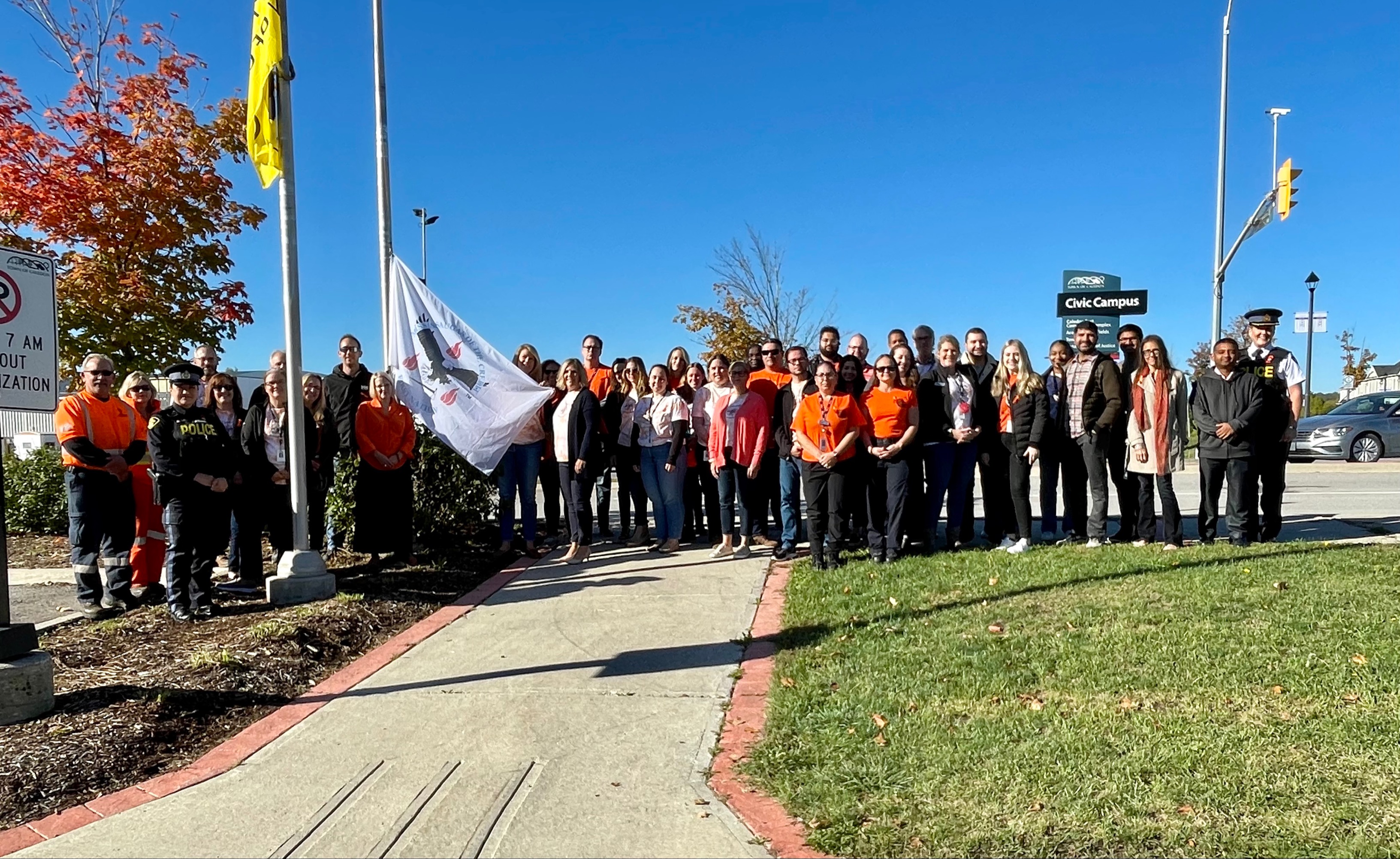 Staff in front of flag pole